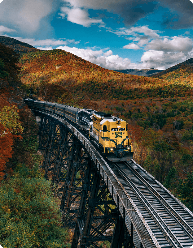 Train journey through mountains in autumn